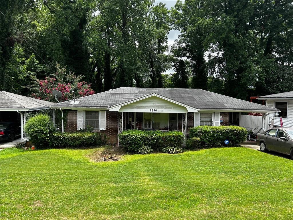 a front view of a house with garden