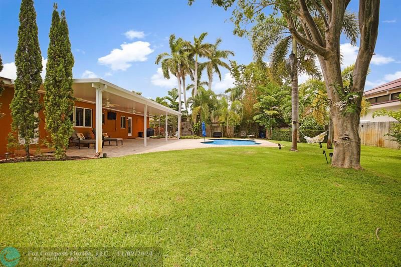 a view of a swimming pool with an outdoor space and seating area