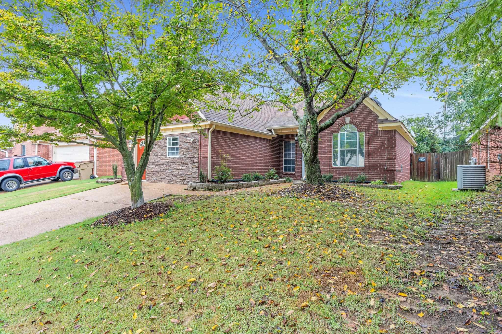 a house with a tree in front of it