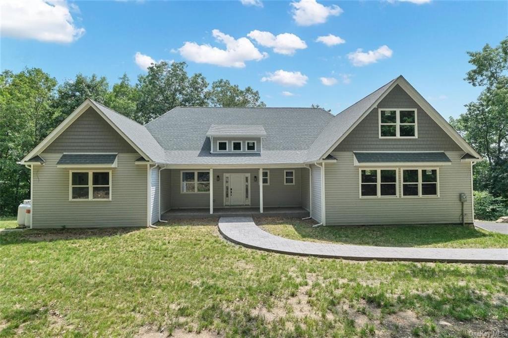 View of front of house with a front lawn