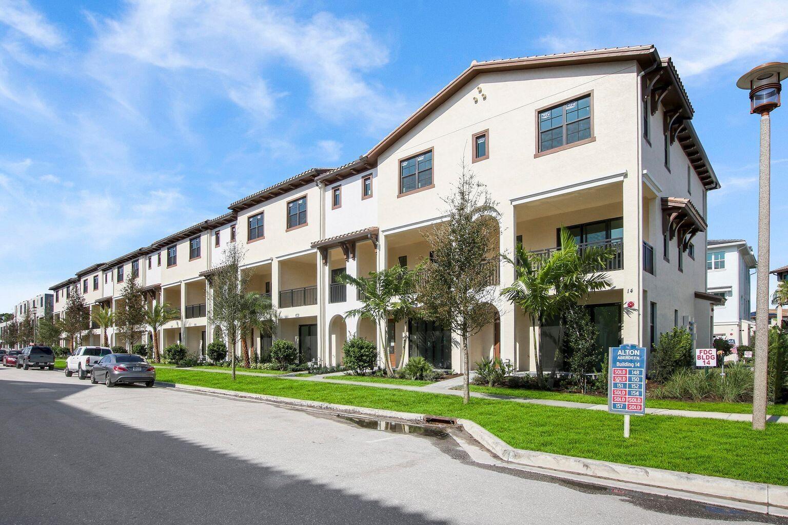 a view of a large building next to a yard