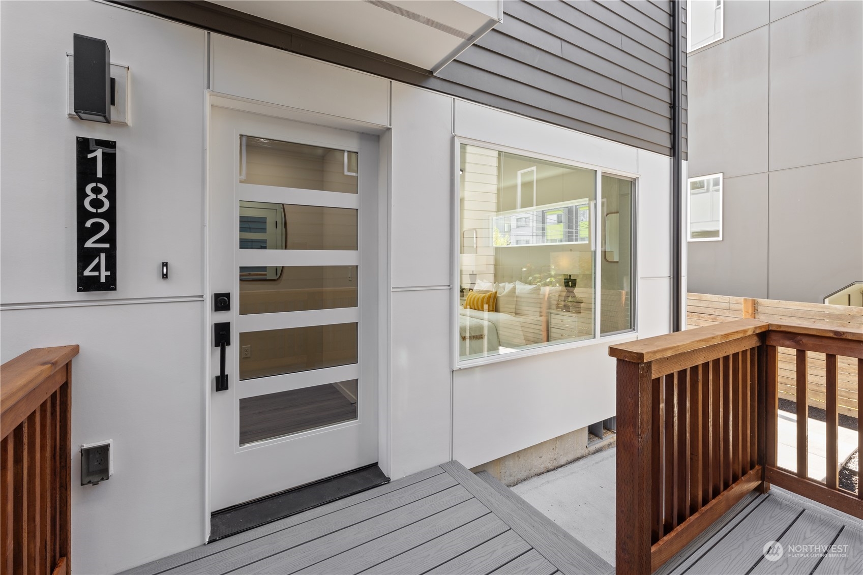 a view of a hallway with windows and entryway