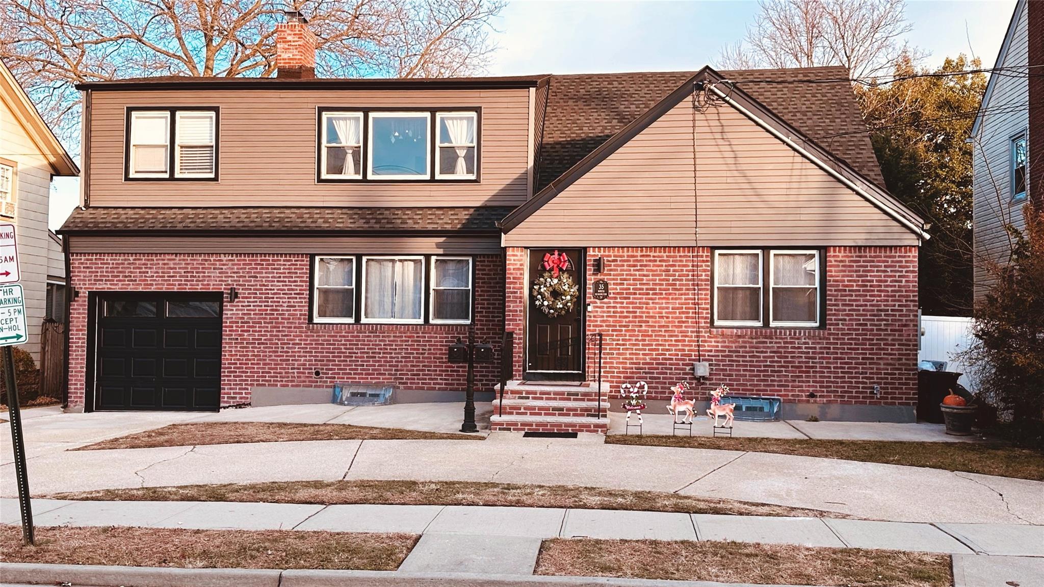 View of front of property with a garage