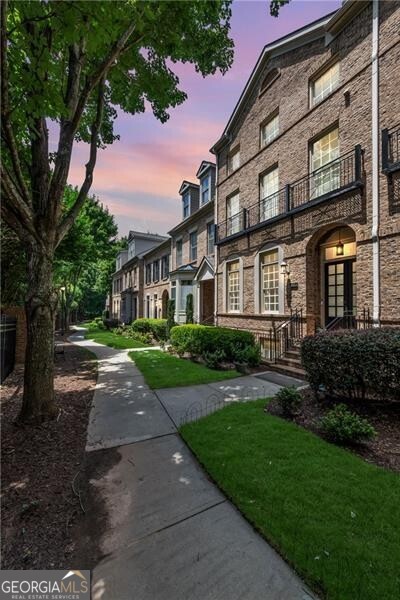 a view of a building with a yard