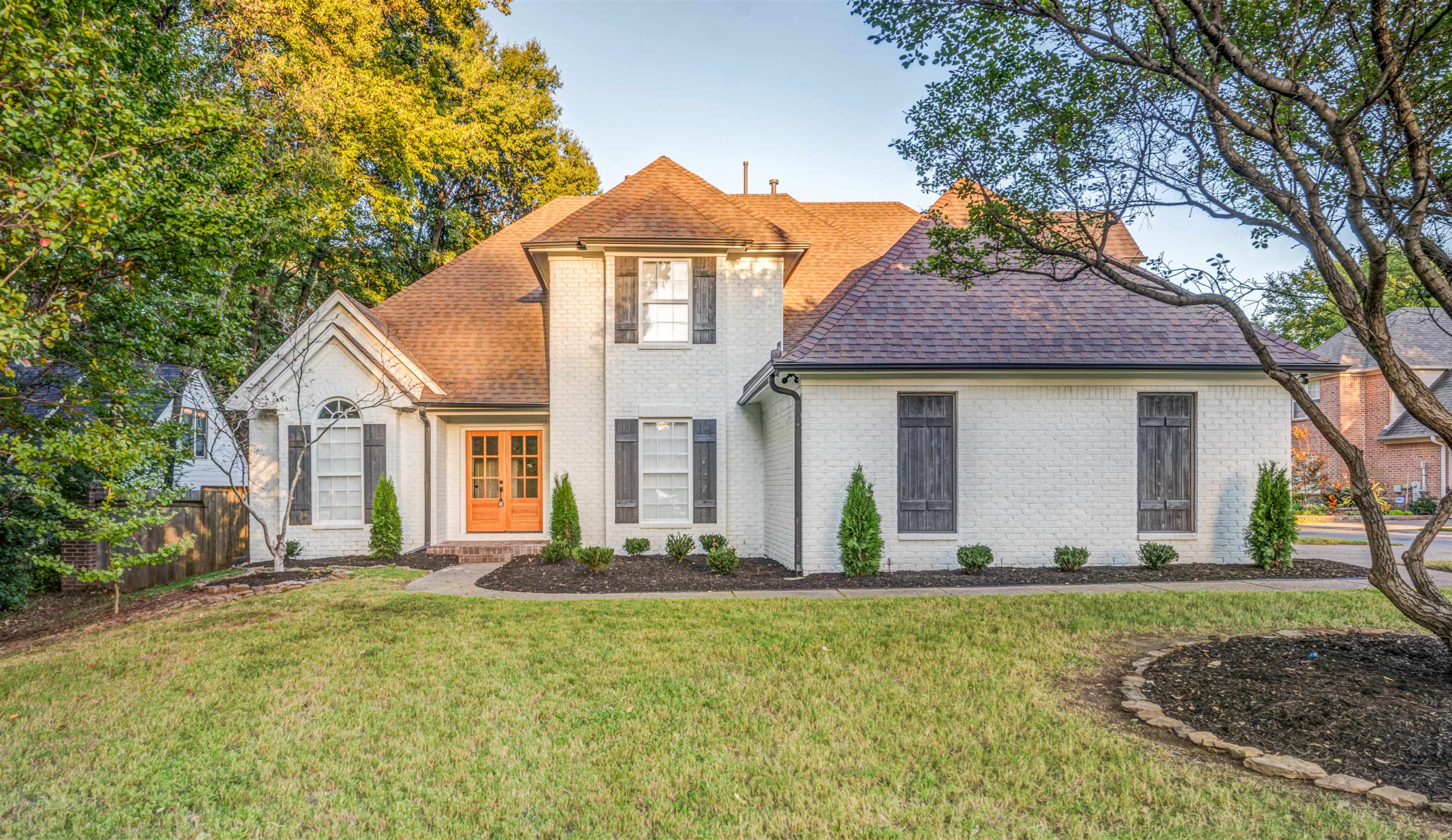 a front view of a house with a yard