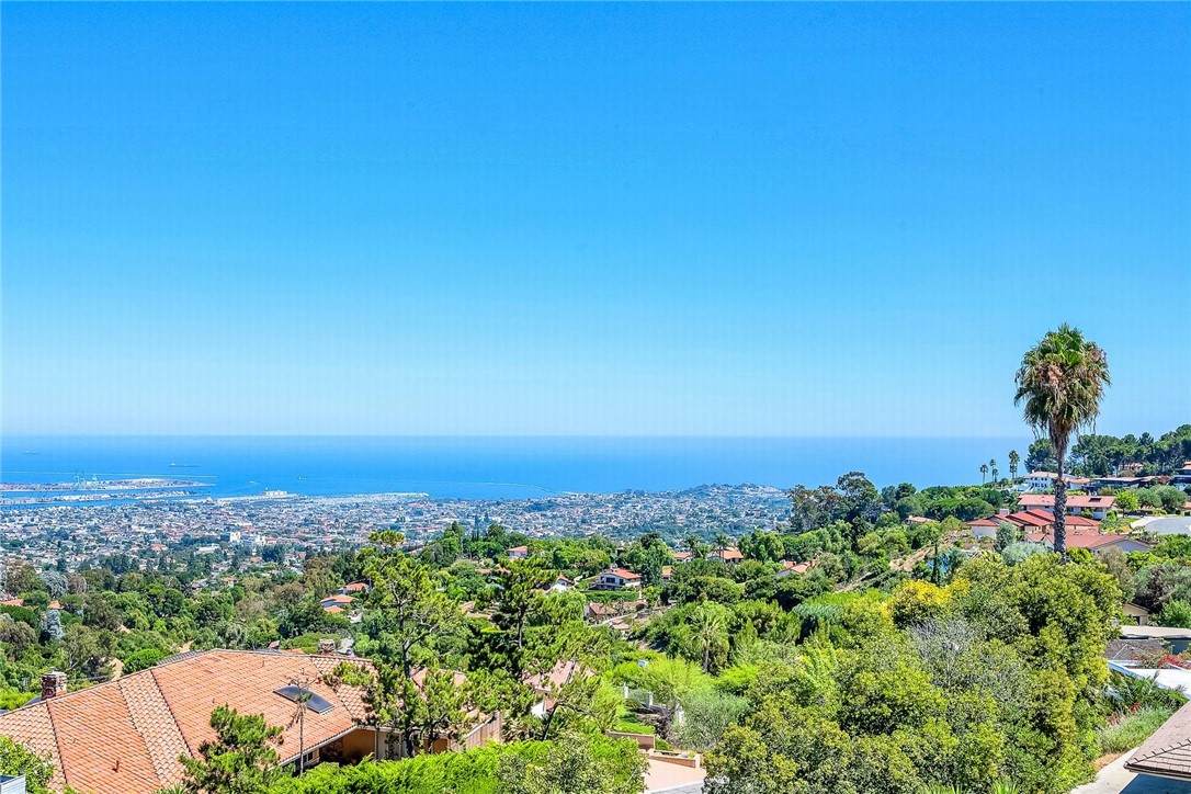 an aerial view of a city and mountain view in back