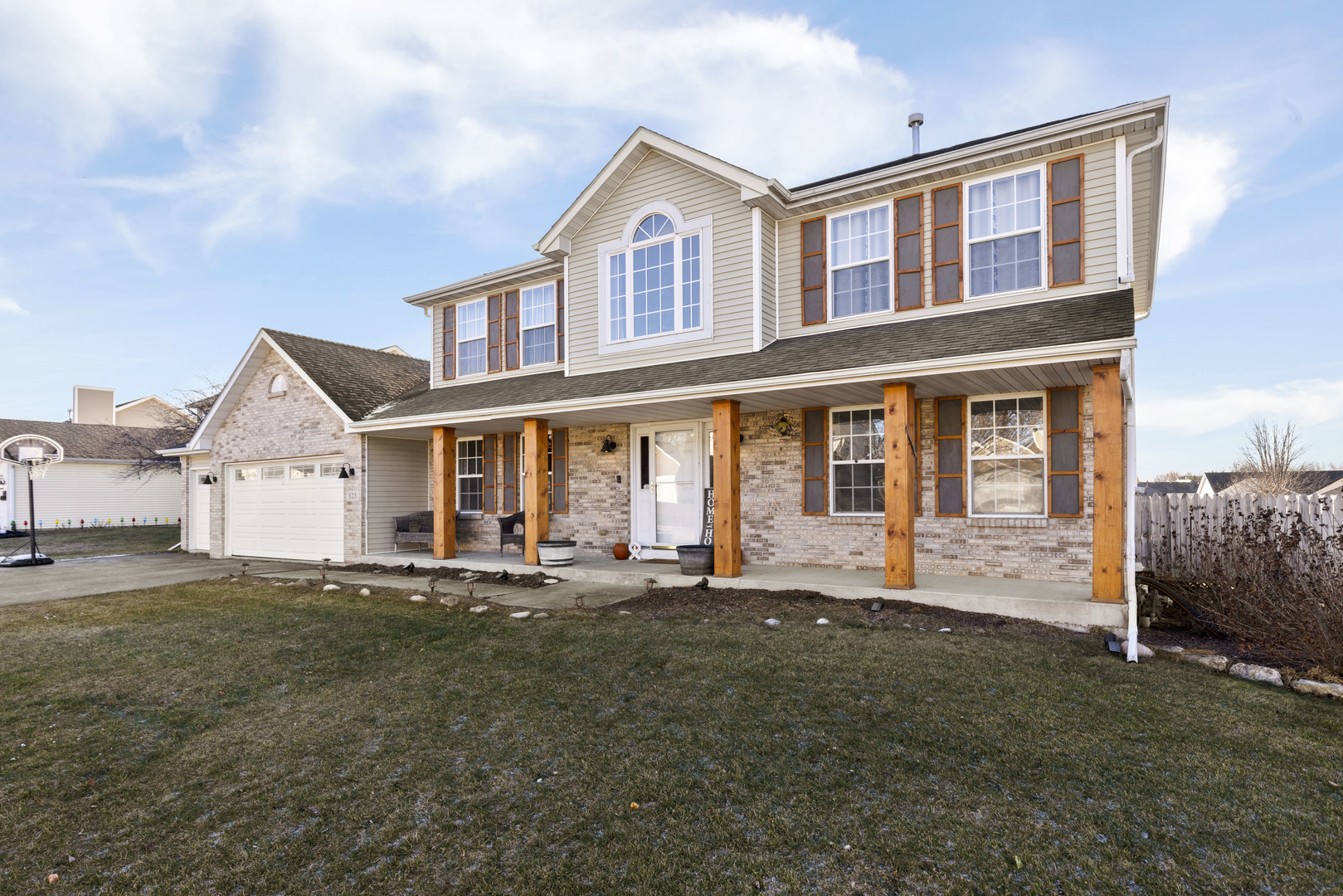 a front view of a house with a yard