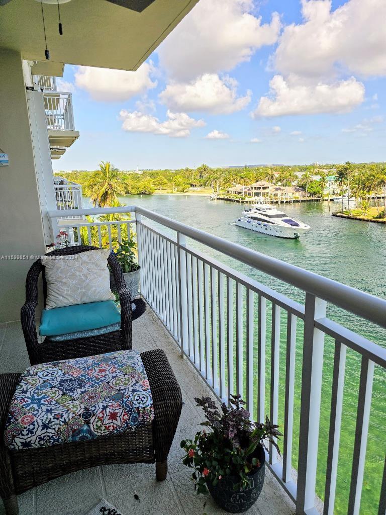 a balcony with furniture and city view