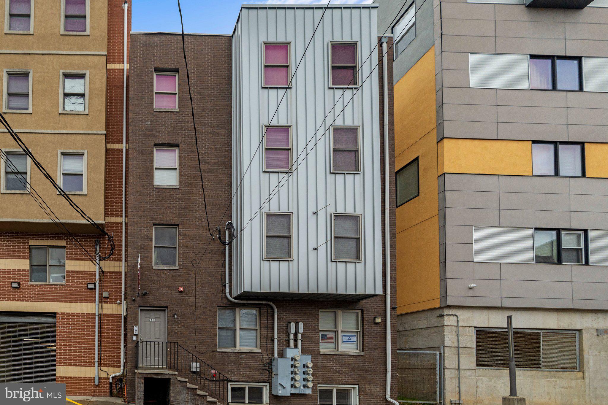 a front view of a building with blue walls