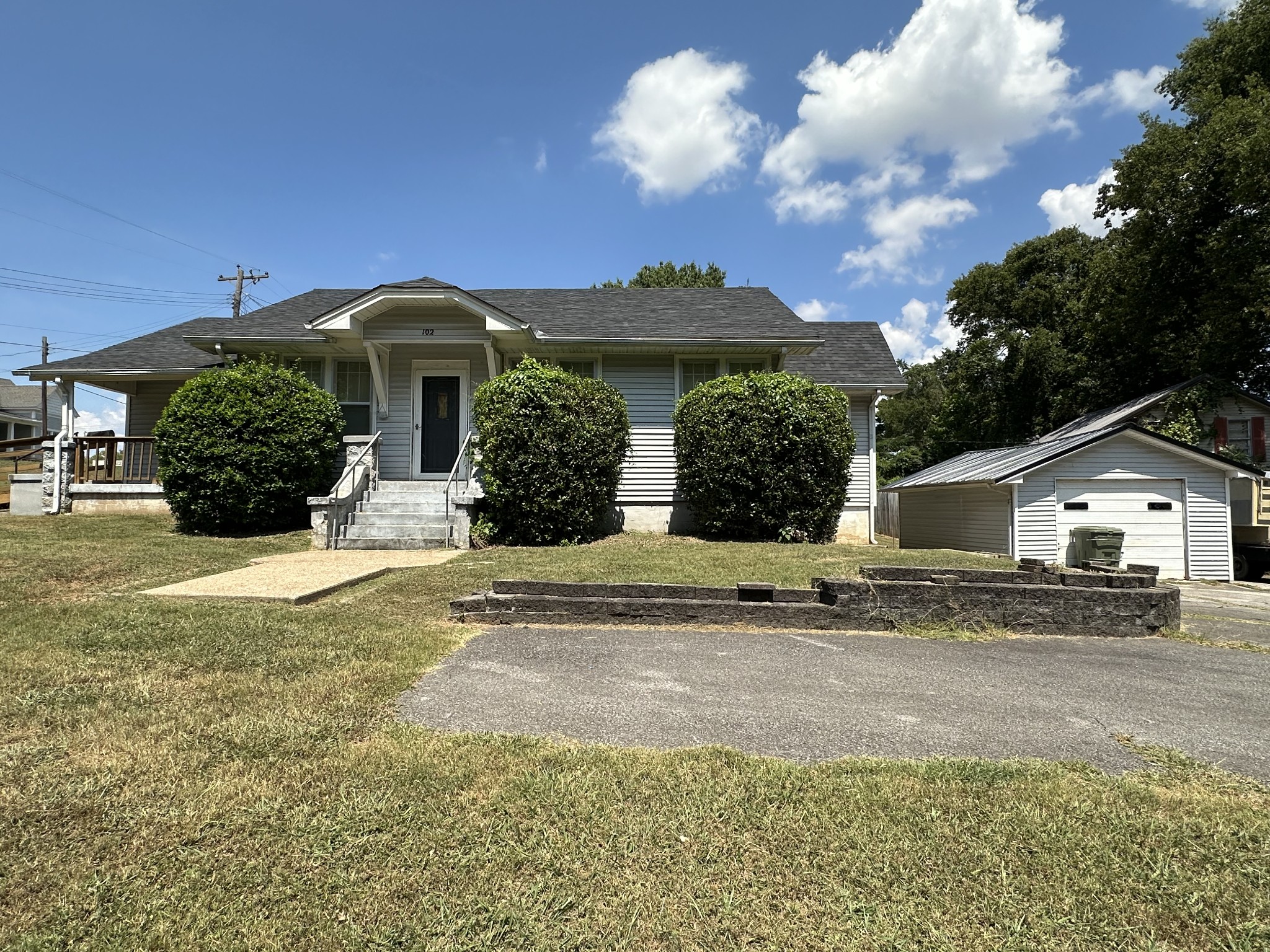 front view of a house with a yard