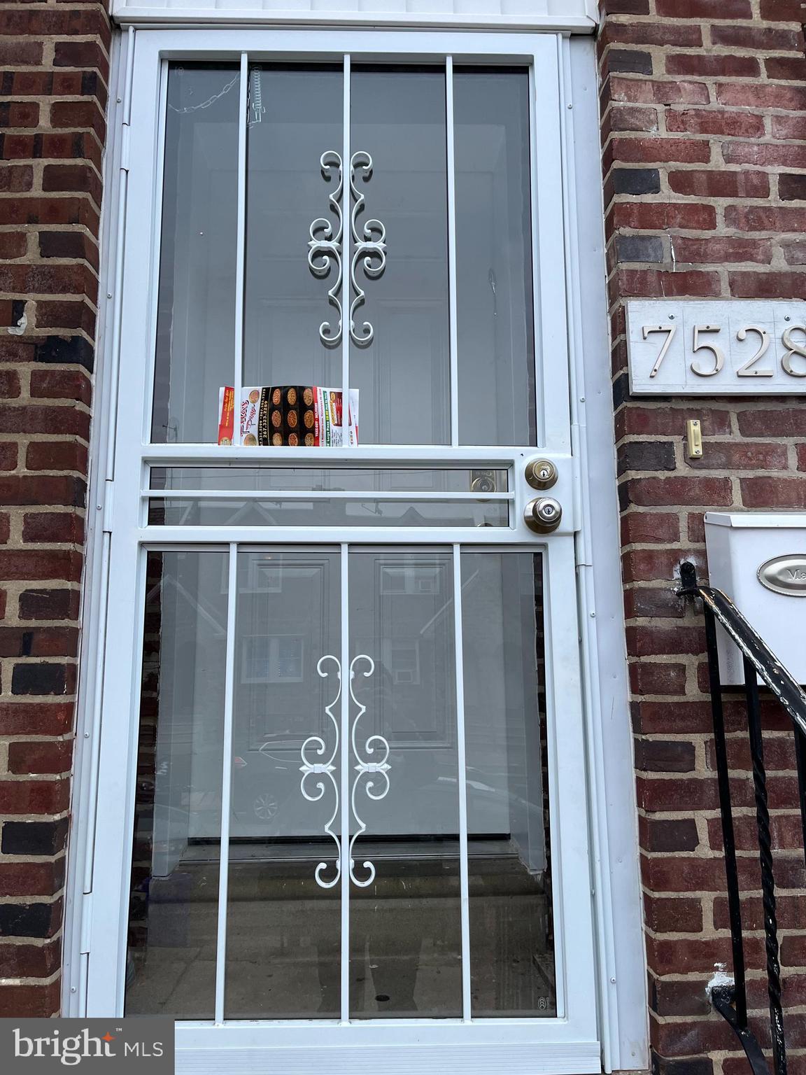 a view of a door and a window