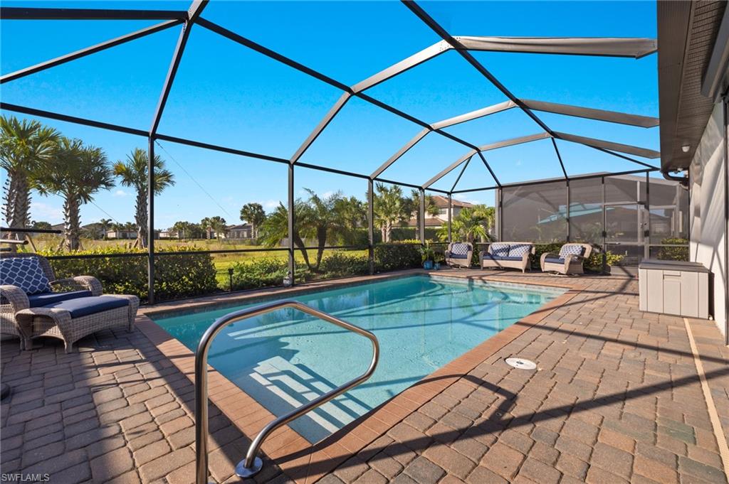 a view of a swimming pool with a patio