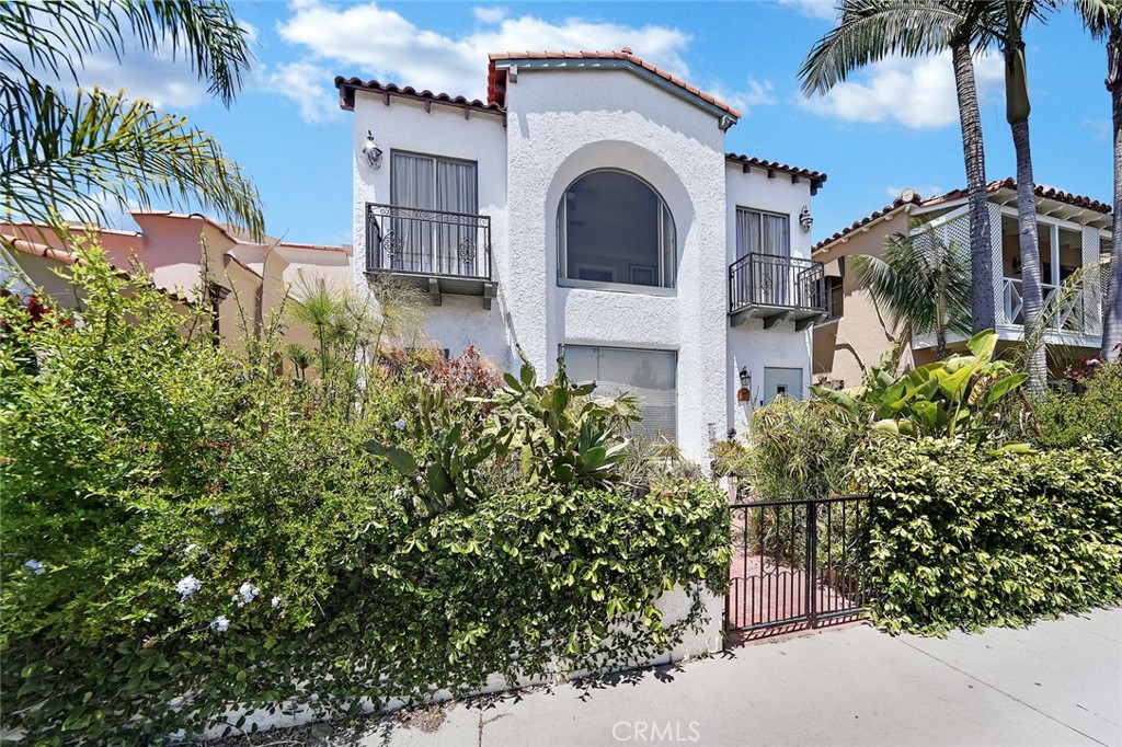 front view of a house with a garden