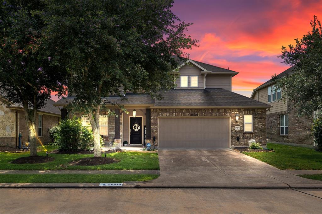 Welcome home to 30019 Willow Brook Lane located on a quiet street in Willow Creek Farms and zoned to Katy ISD! This stunning home has lovely curb appeal, a well-manicured lawn, beautiful landscaping, brick elevation, dark stained front door, covered front porch, traditional style, beautiful outdoor lanterns and a double wide driveway!