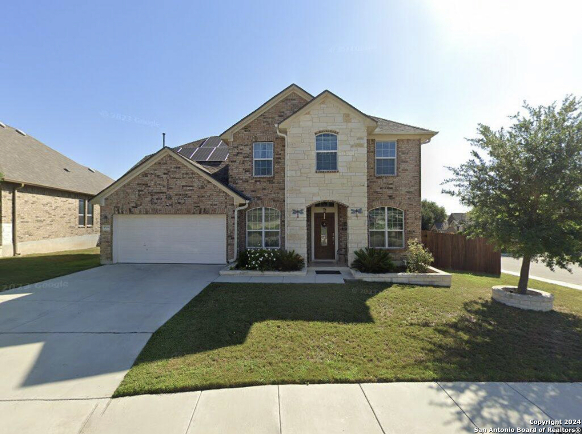 a view of house with yard