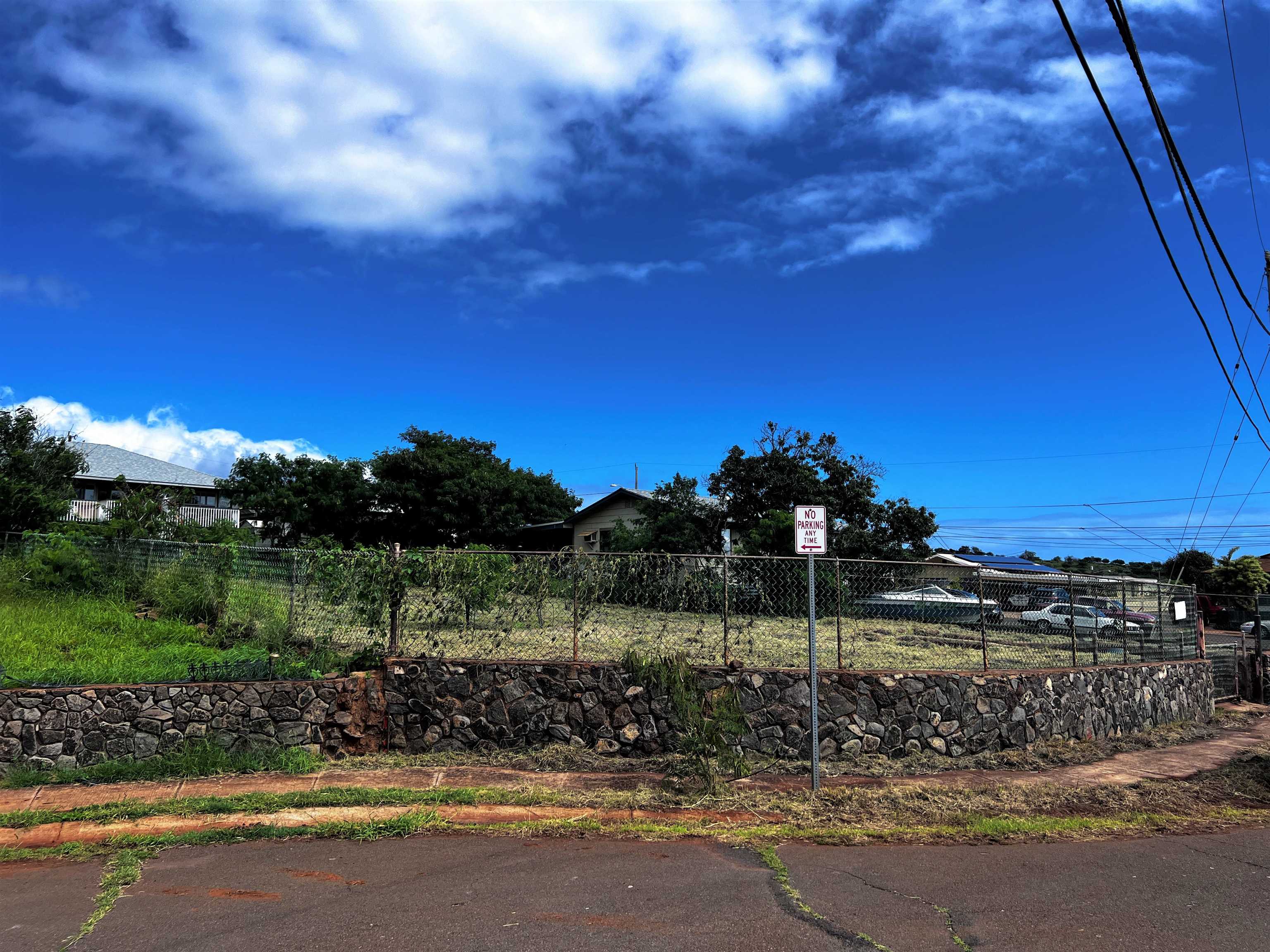 a view of a street with a building in the background