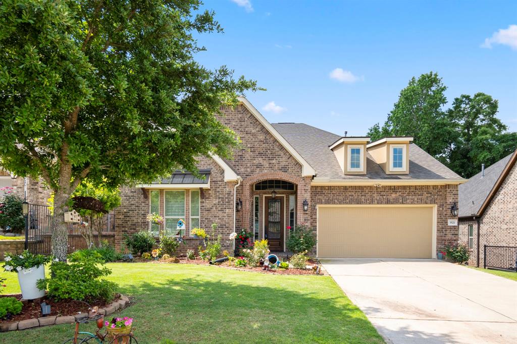 a front view of house with yard outdoor seating and green space