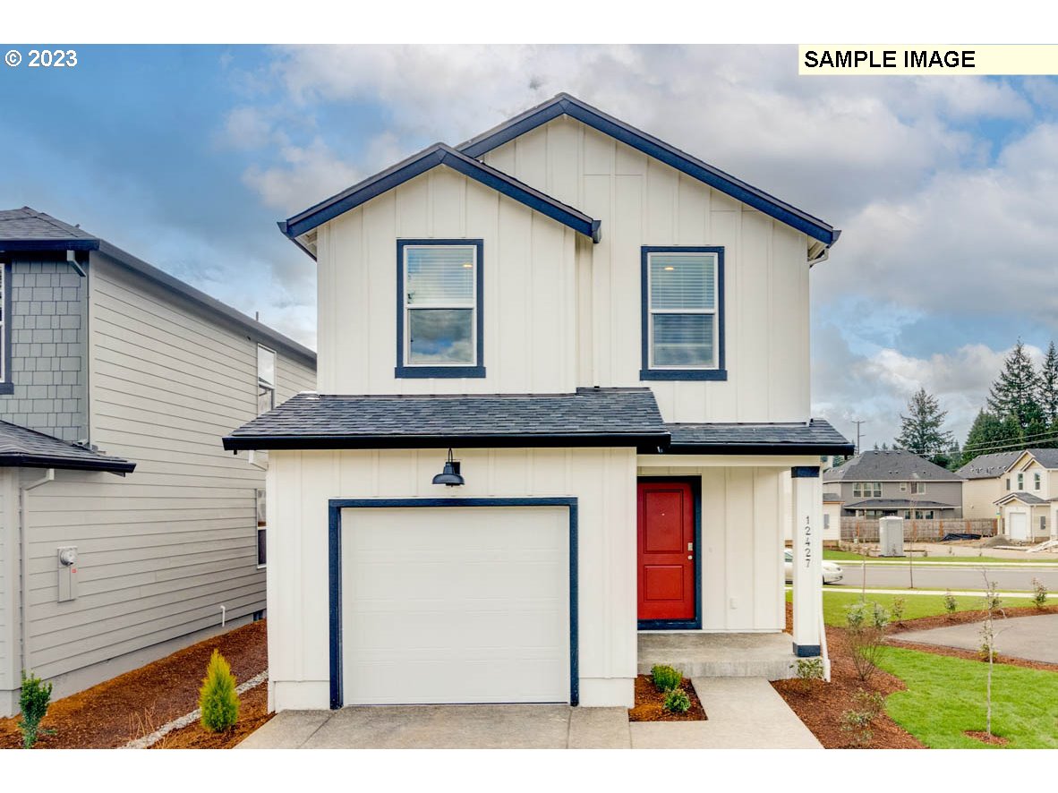 a front view of a house with garage