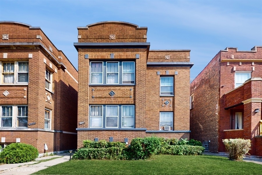 front view of a building with a yard