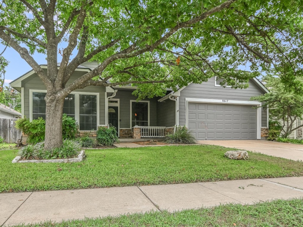 front view of a house with a yard