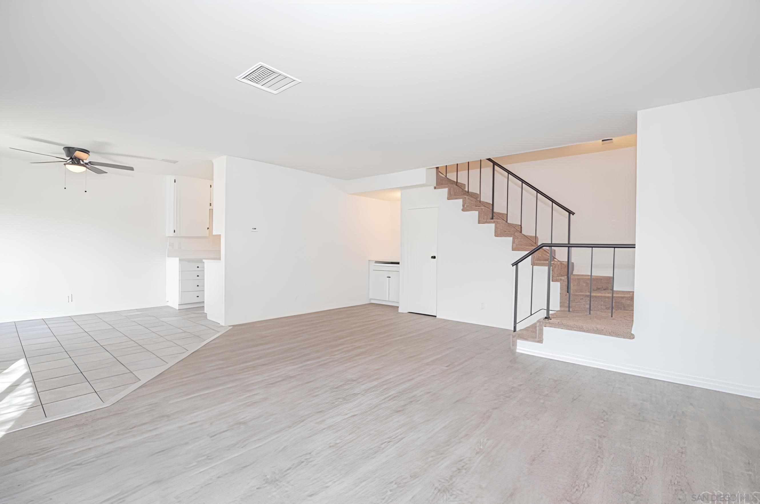 a view of entryway and hall with a workspace