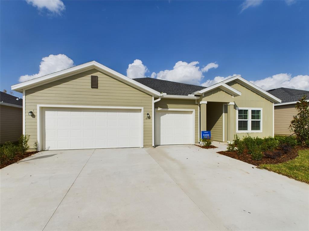 a front view of a house with a garage