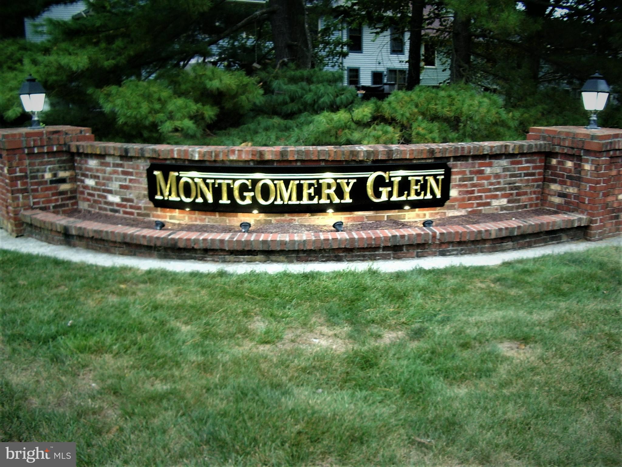 a view of outdoor space with a garden and signage