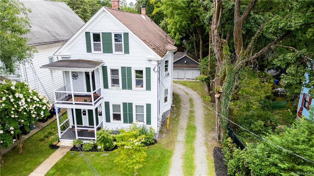 a aerial view of a house with a yard