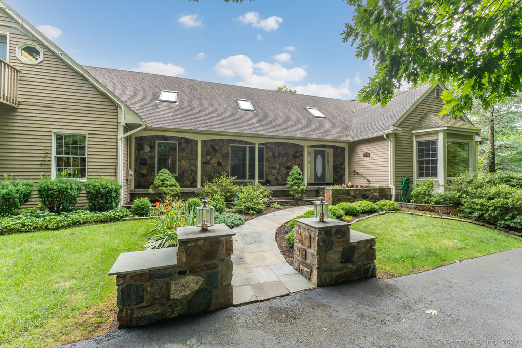 Stone accents and walk way greet you