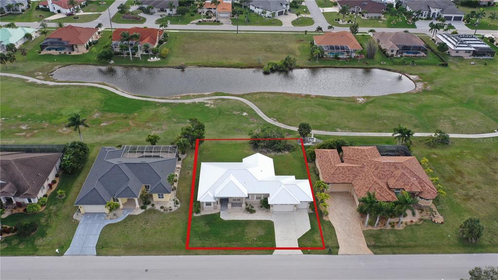 an aerial view of houses with outdoor space