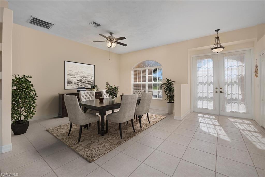 a view of a dining room with furniture and chandelier