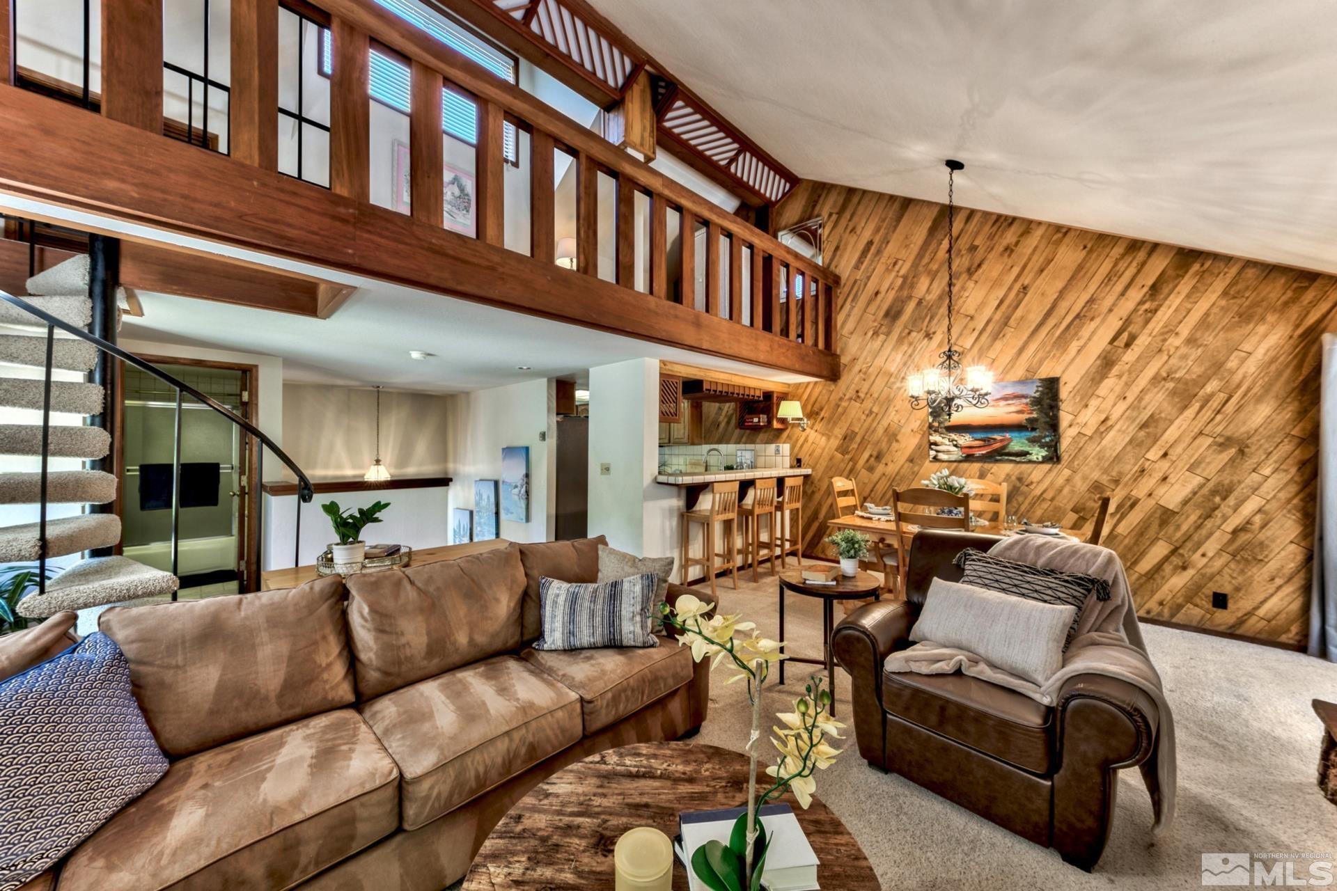 a view of a living room with a couch and a table