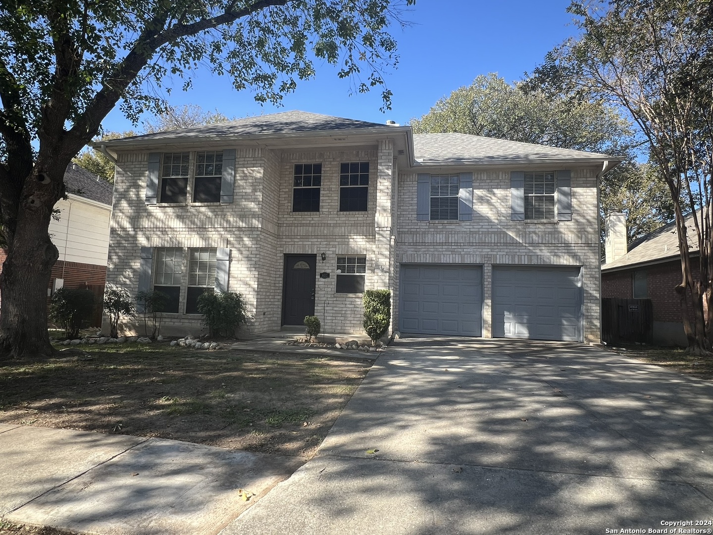 a front view of a house with a garage