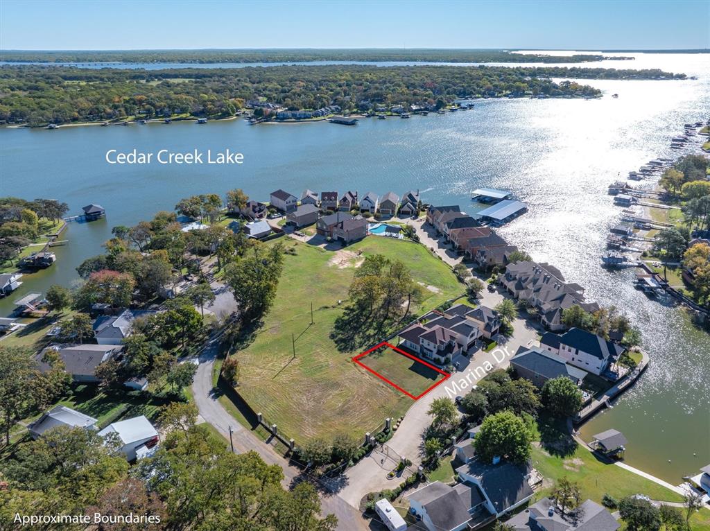 an aerial view of a houses with ocean view