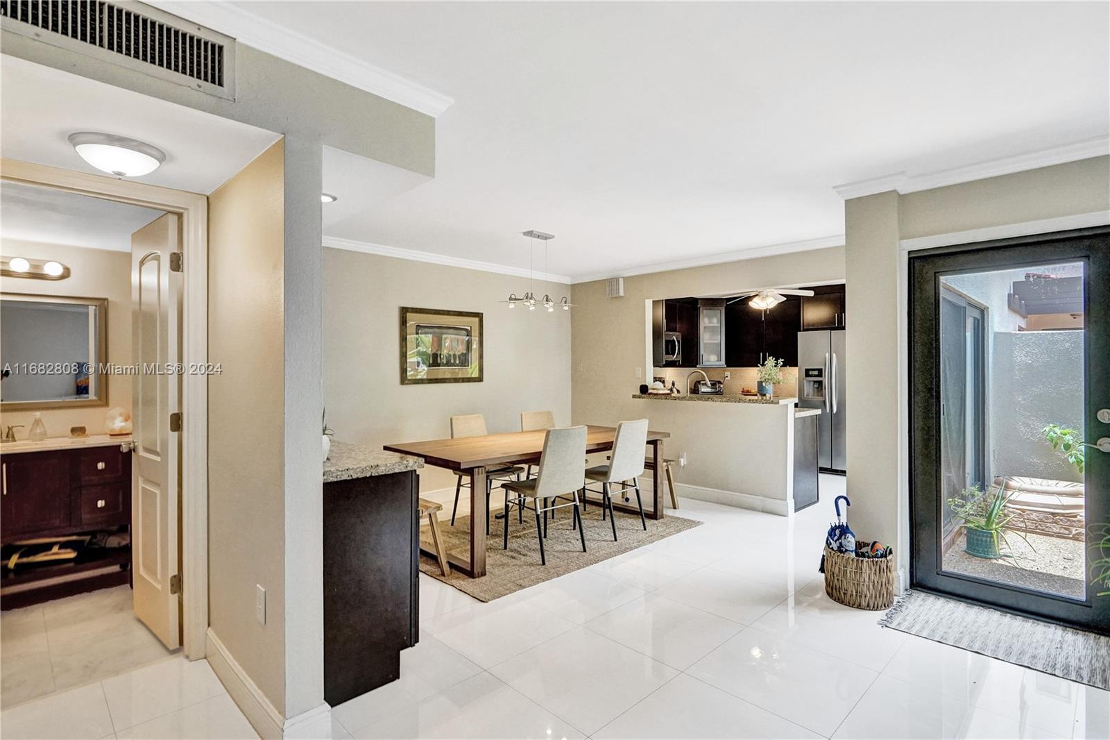 a view of a living room kitchen and a window