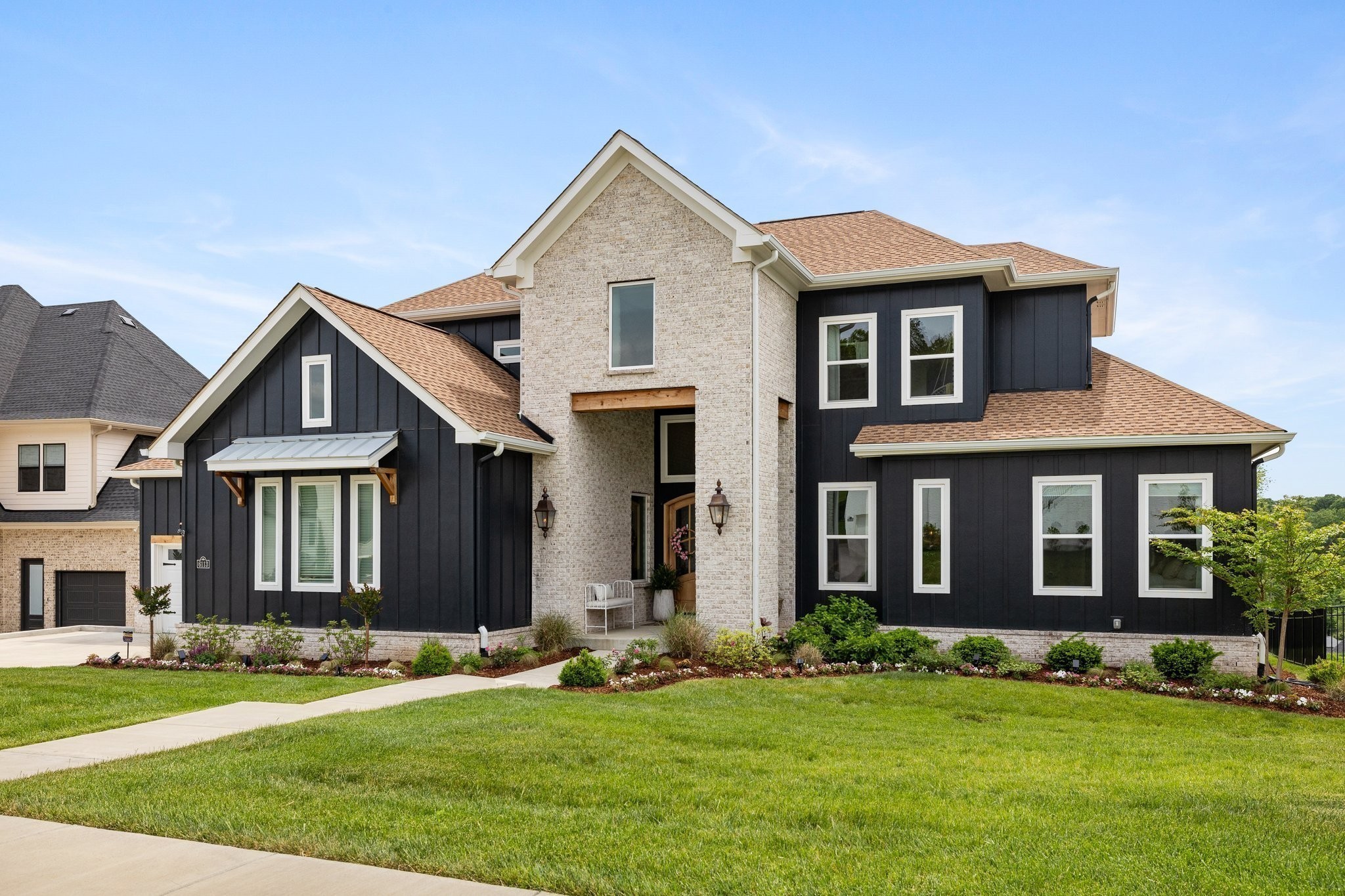 front view of a house with a yard