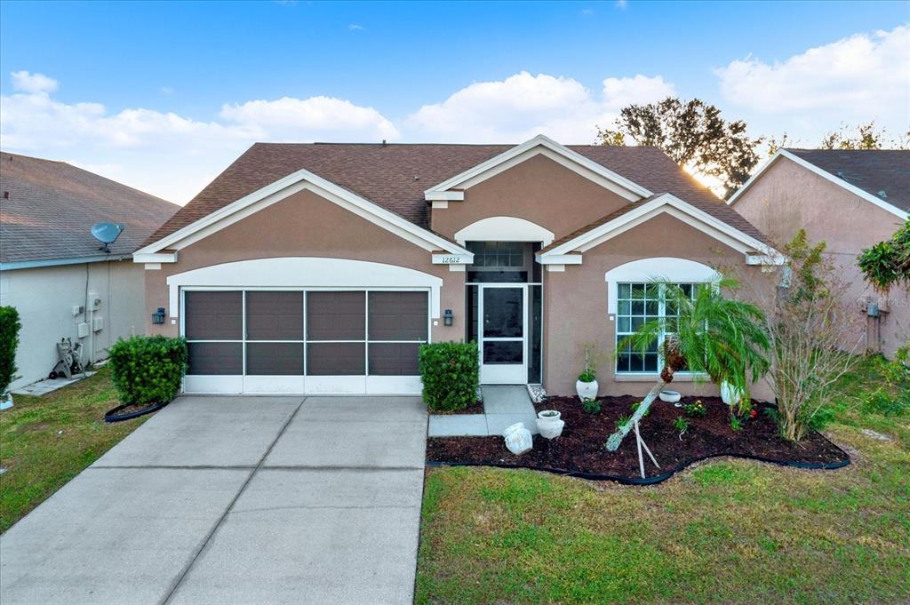 a view of a house with a backyard