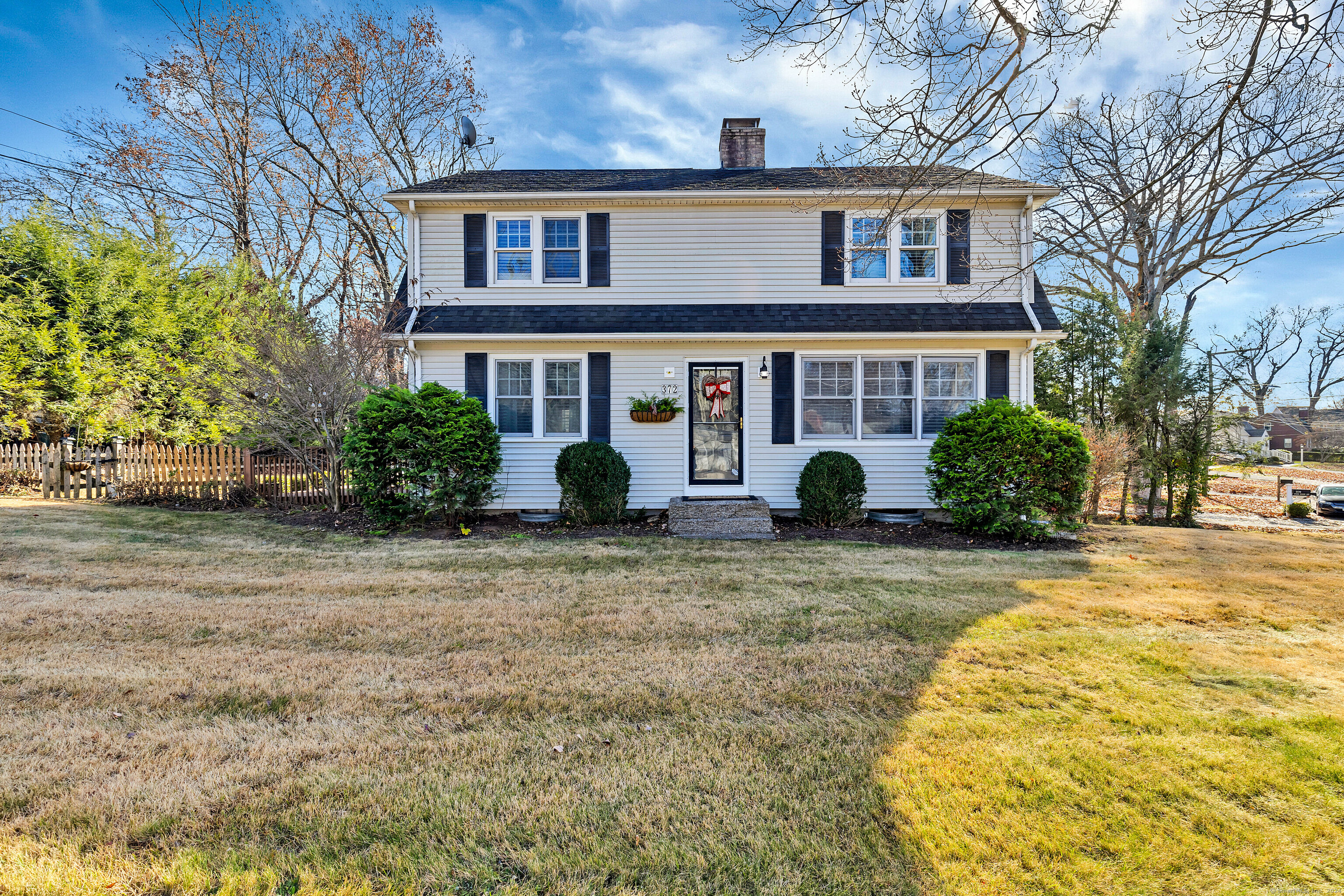 a view of a house with a yard and plants