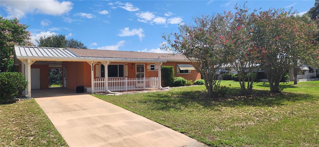 front view of a house with a yard