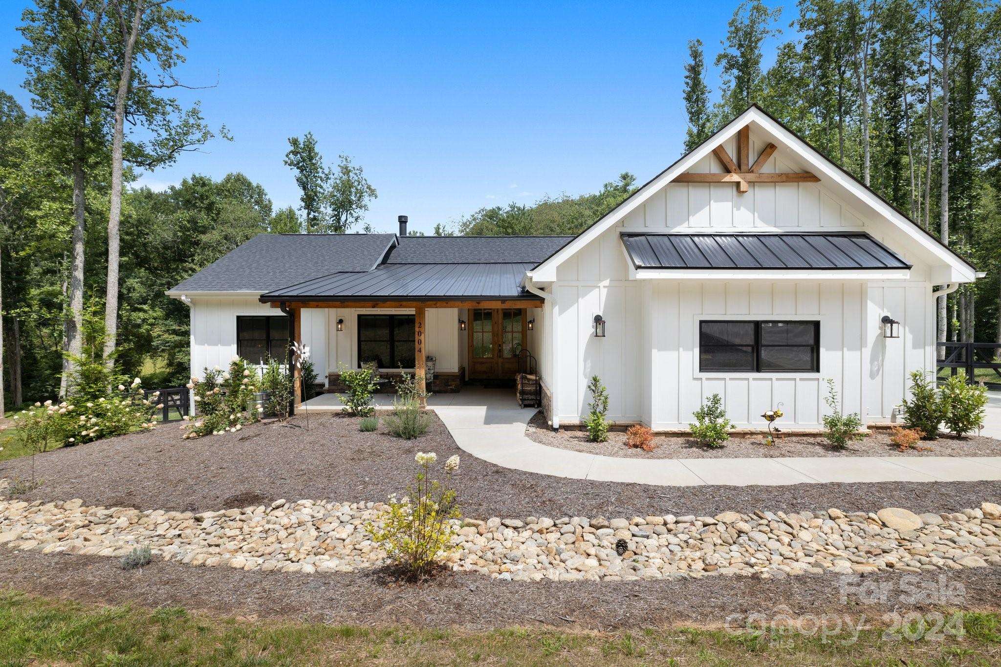 a front view of a house with garden