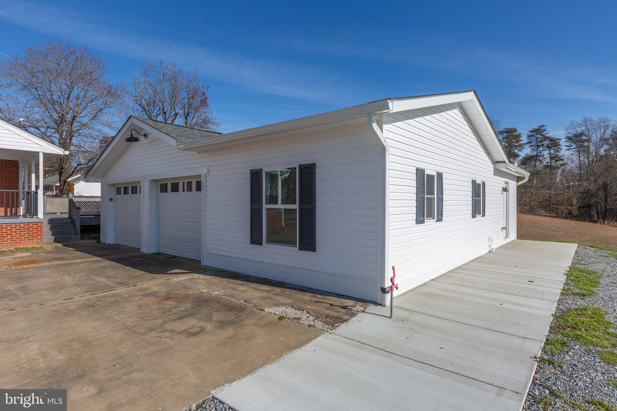 a view of house with yard