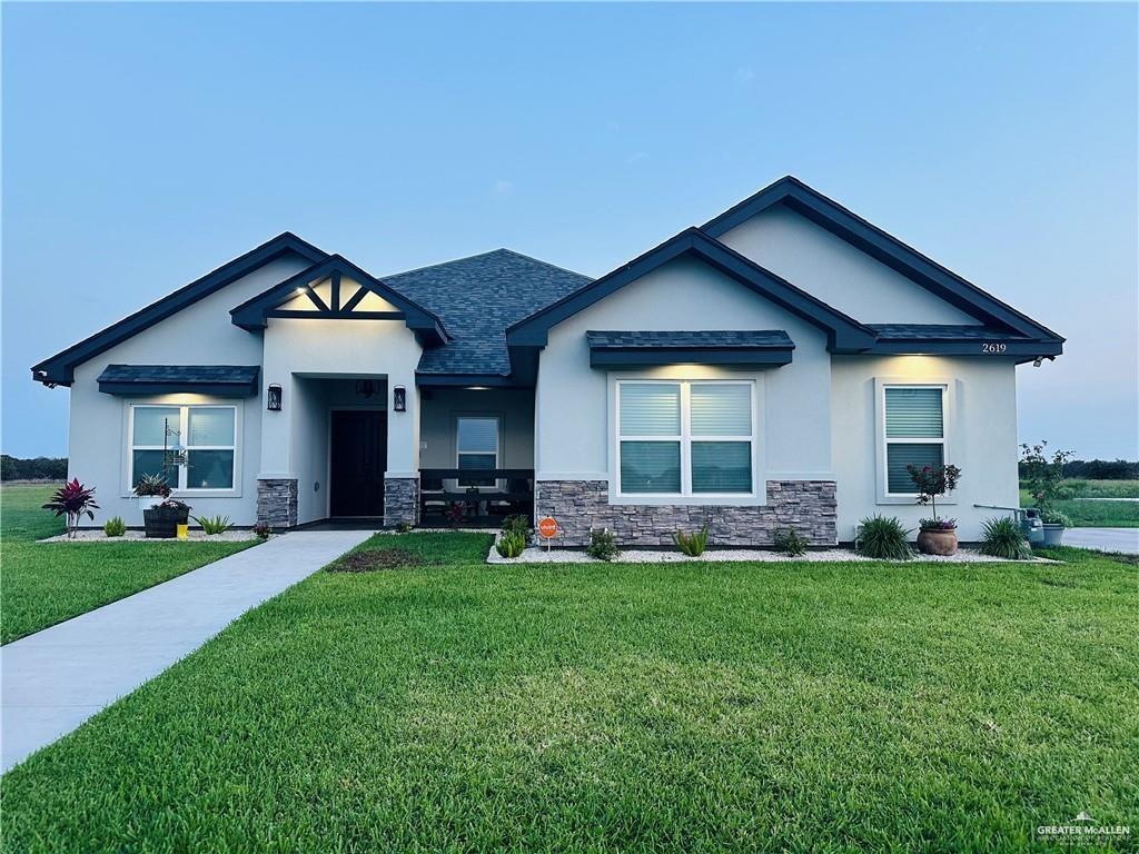 View of front of property featuring a front yard