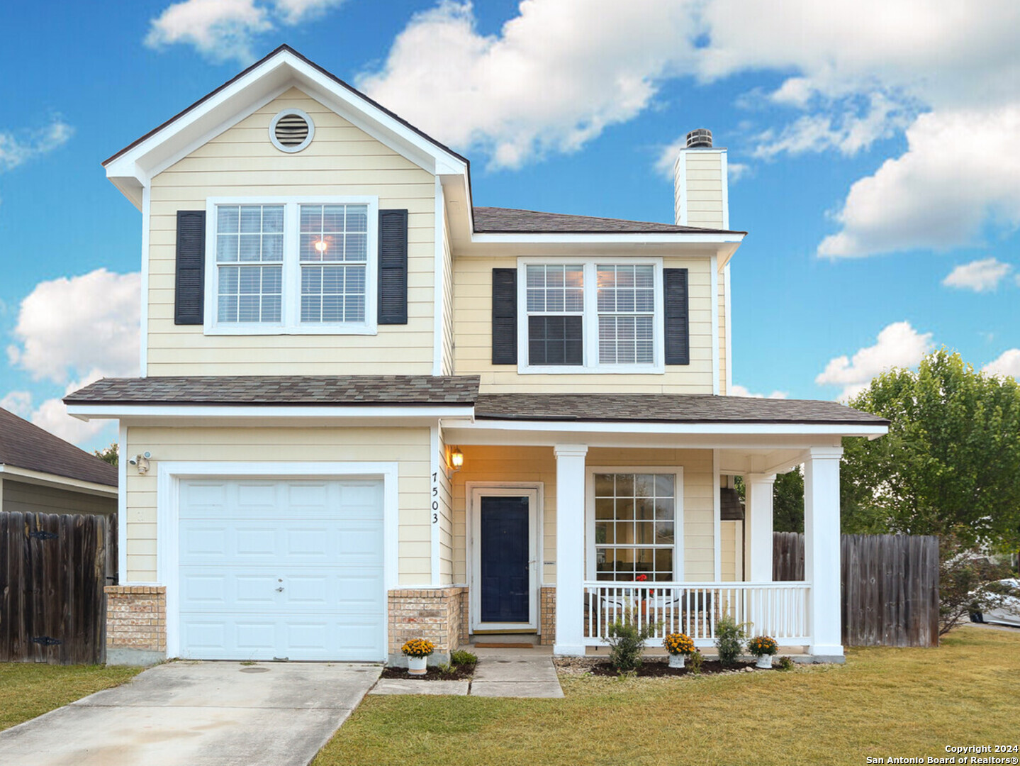 front view of a house with a yard