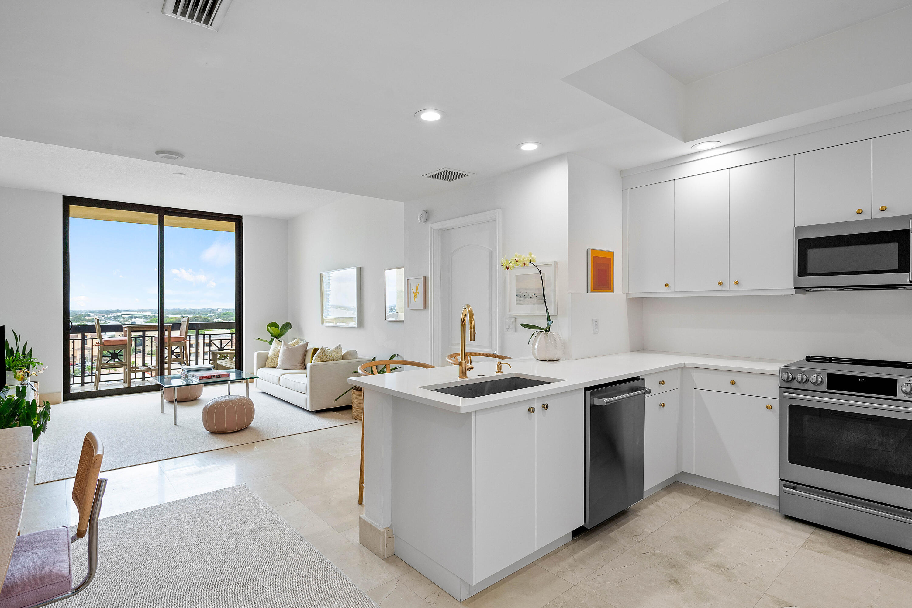 a kitchen that has a sink and a stove in it