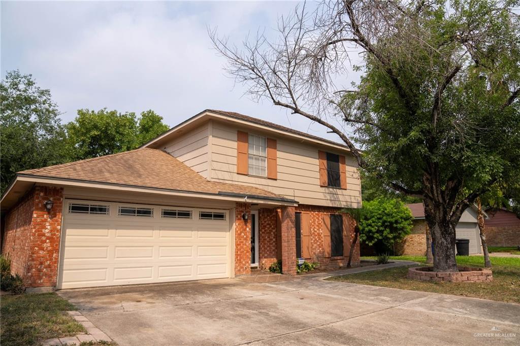 View of property with a garage