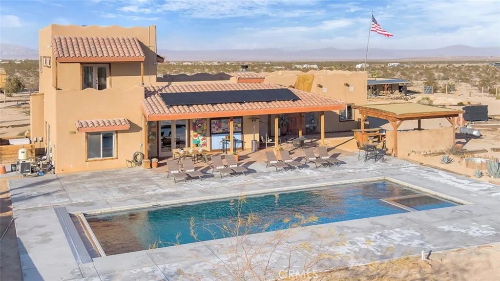 an aerial view of a house with outdoor space