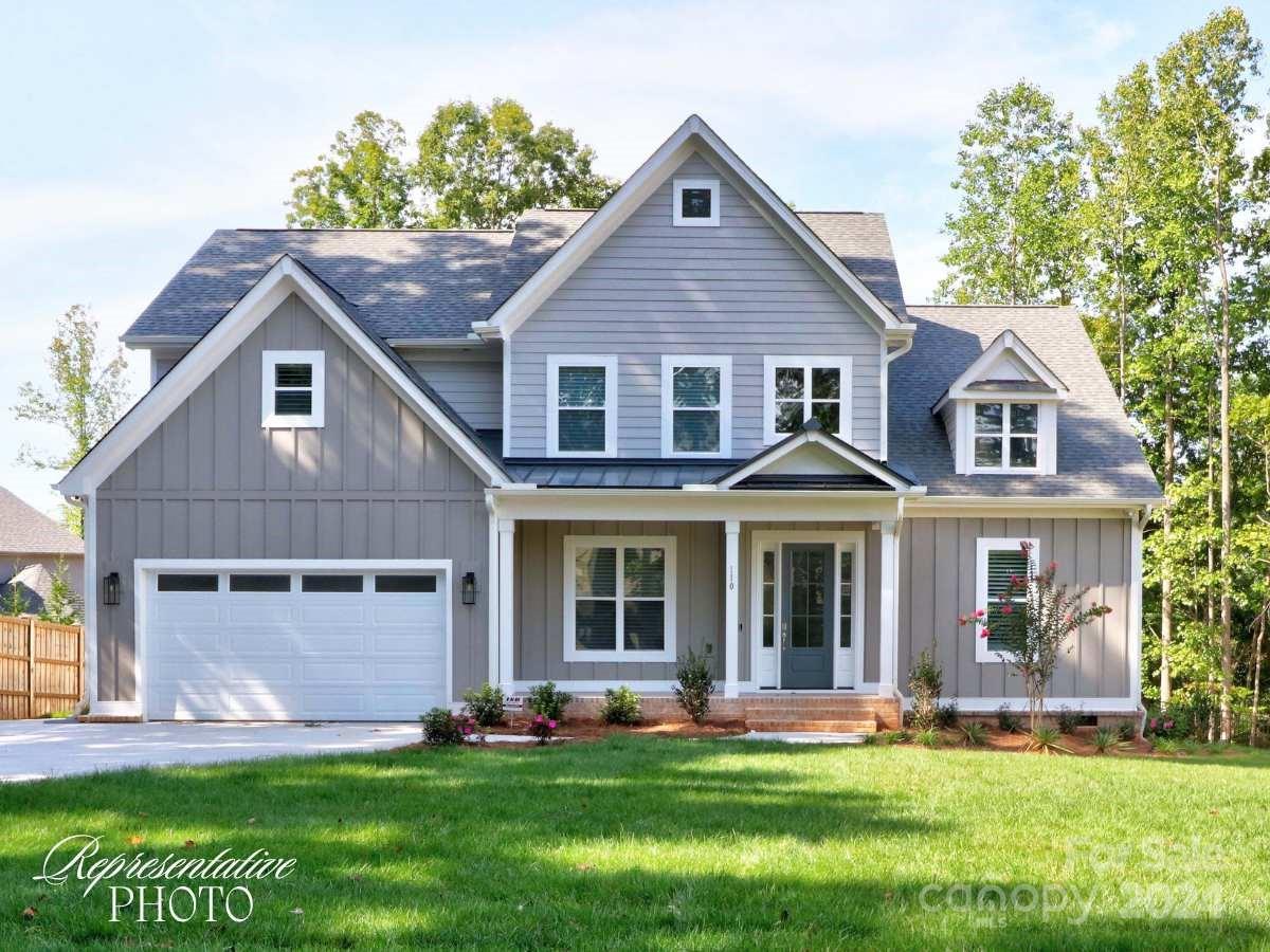 front view of a house with a yard