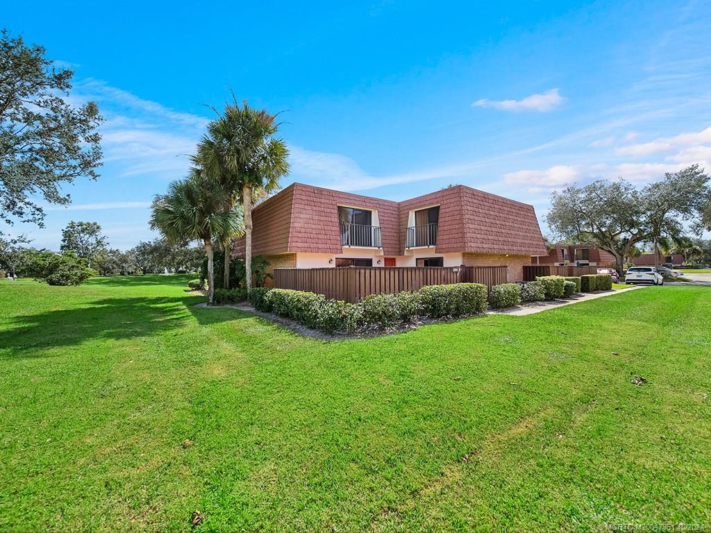 a view of a house with a big yard