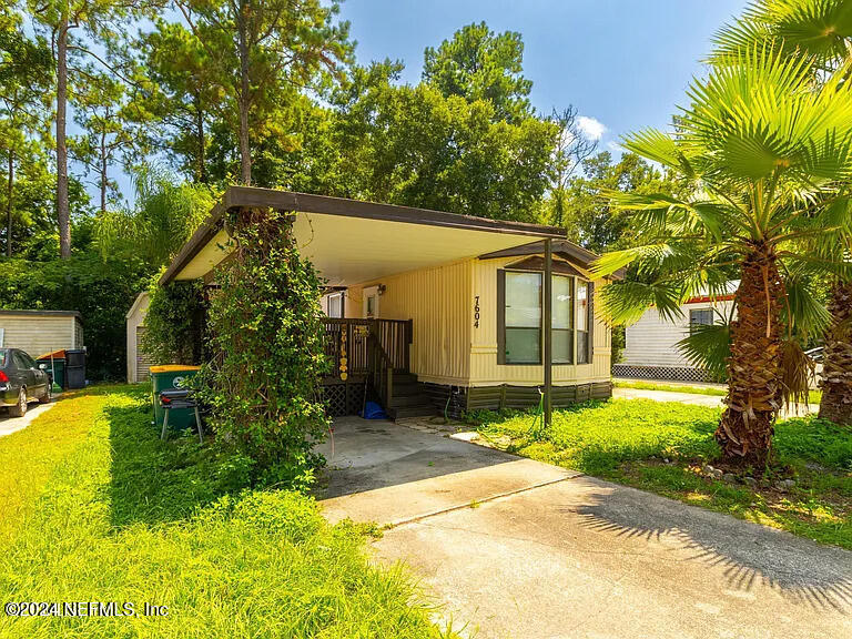 front view of a house with a yard