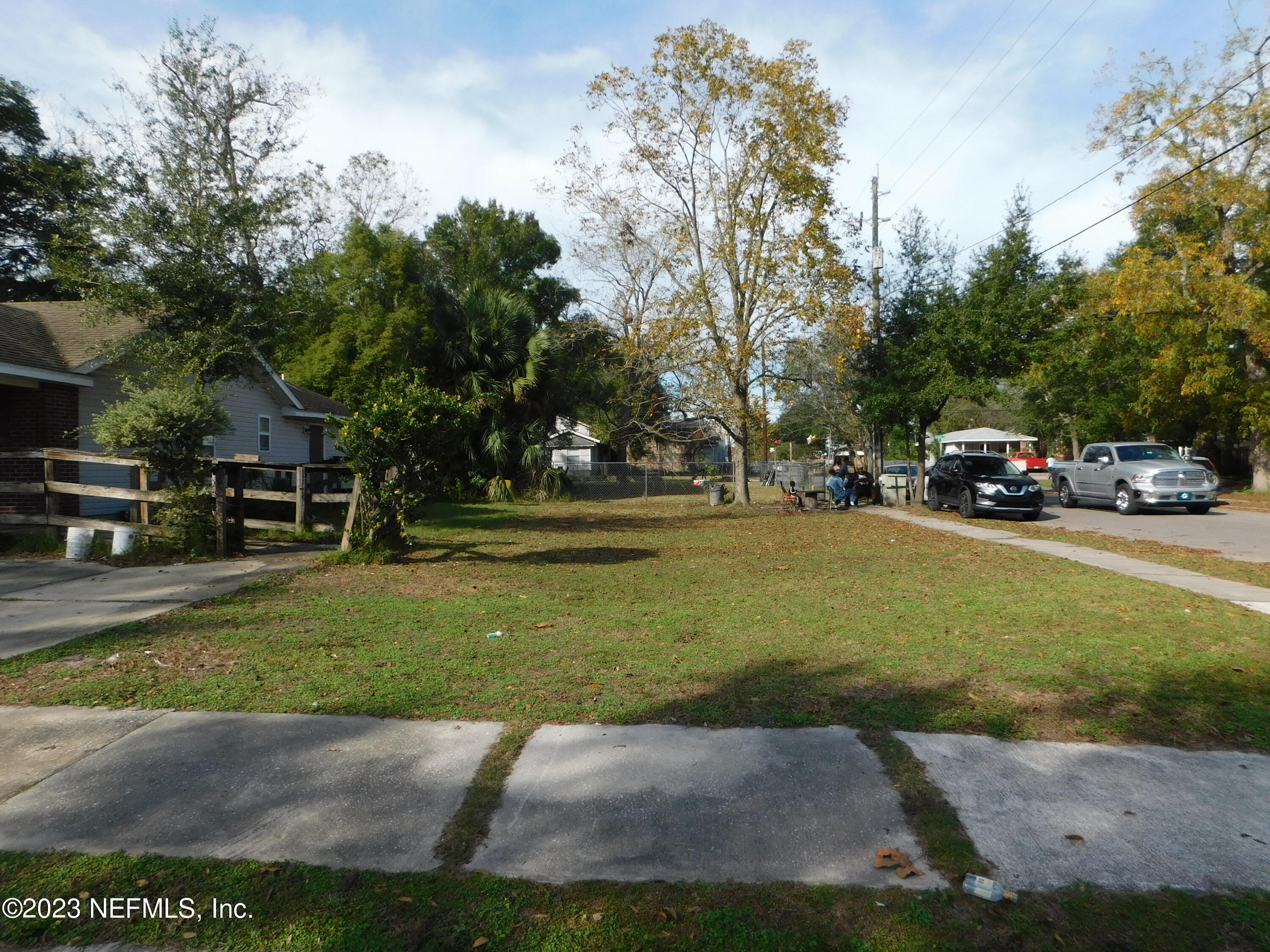 a view of street with parked cars